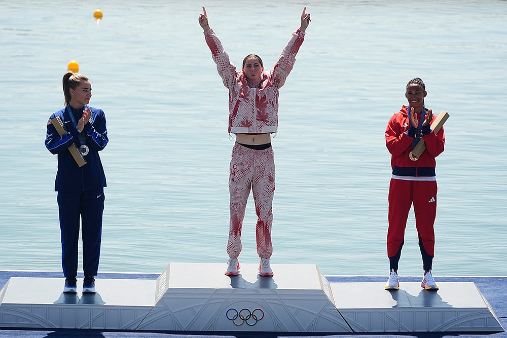| Photo: AP/Lindsey Wasson : Paris Olympics women's canoe single 200-meter: Silver medalist Nevin Harrison, of the United States, from left, gold medalist Katie Vincent, of Canada, and bronze medalist Yarisleidis Cirilo Duboys, of Cuba